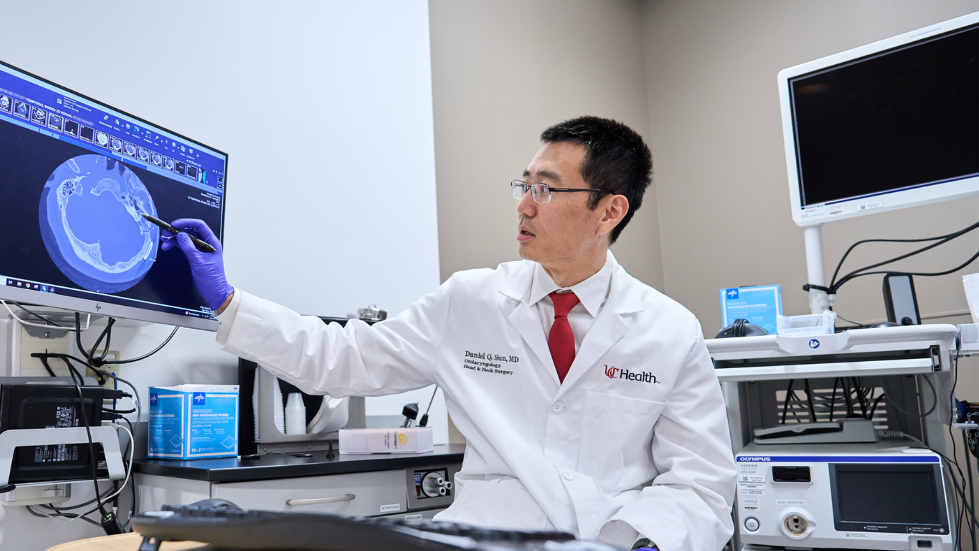 Dr. Sun at UC Health points to image on computer screen