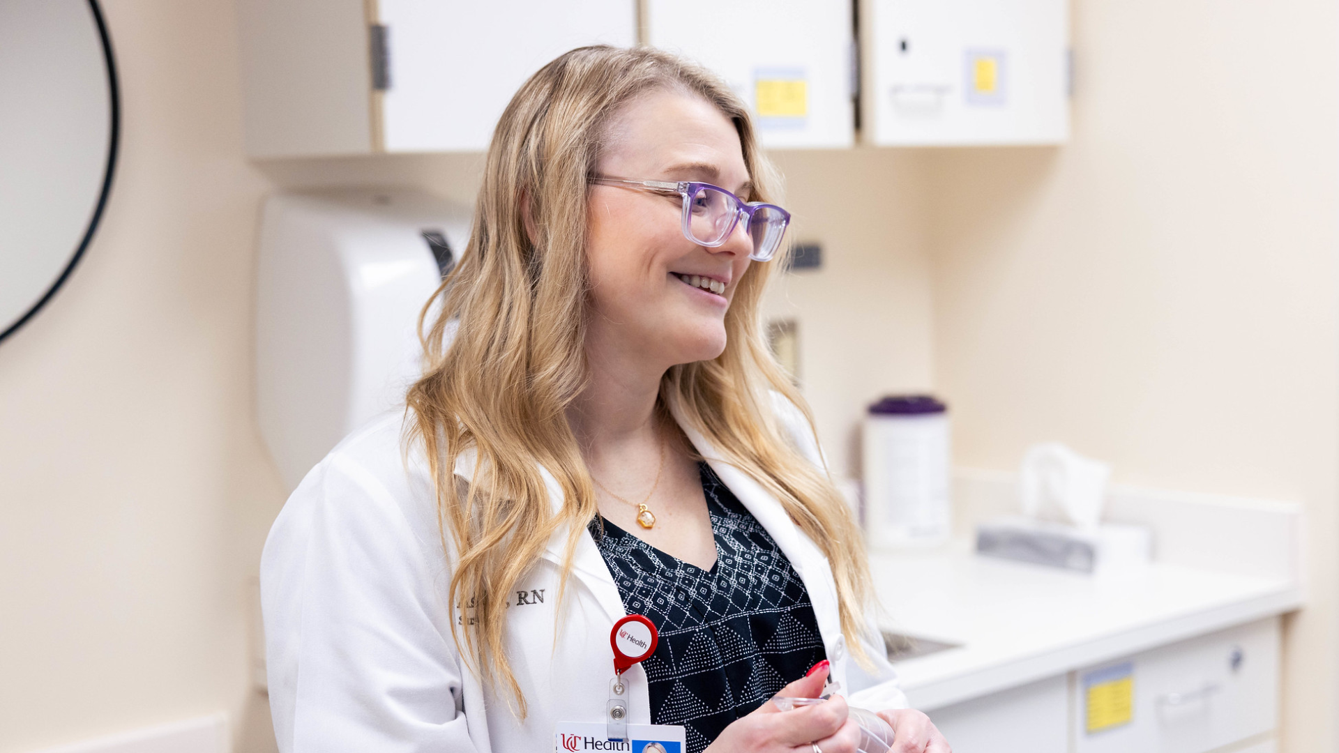 Physician looks at image on a computer screen. 