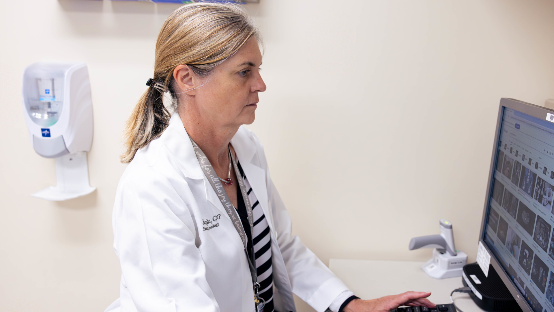 Physicians perform surgical procedure in a medical environment.