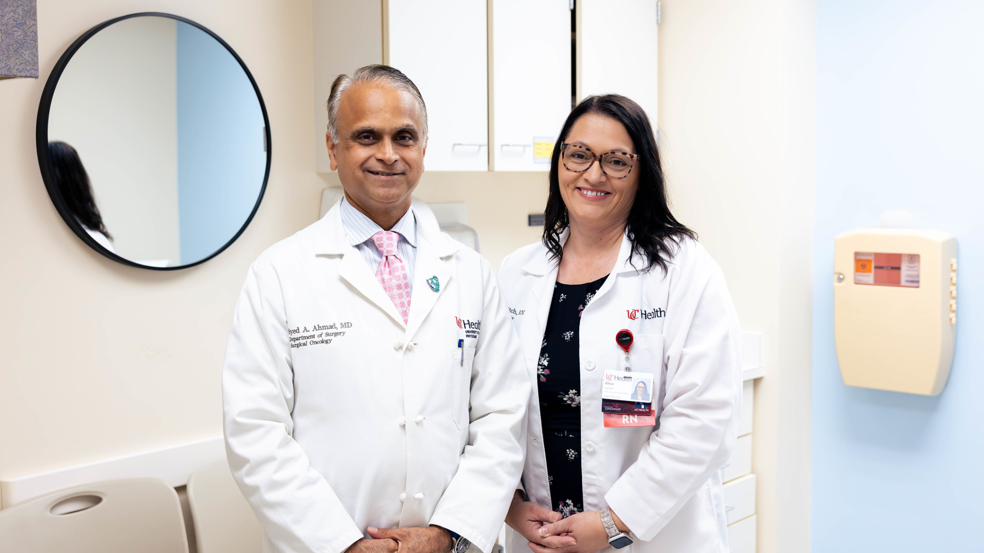 Patient and physicians talk in a medical office.