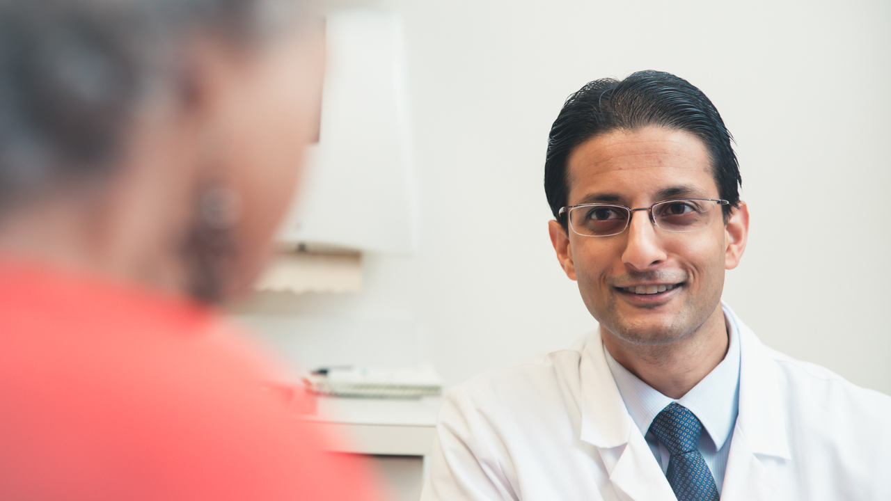 Dr. Sameer Patel at the University of Cincinnati Cancer Center meets with a patient