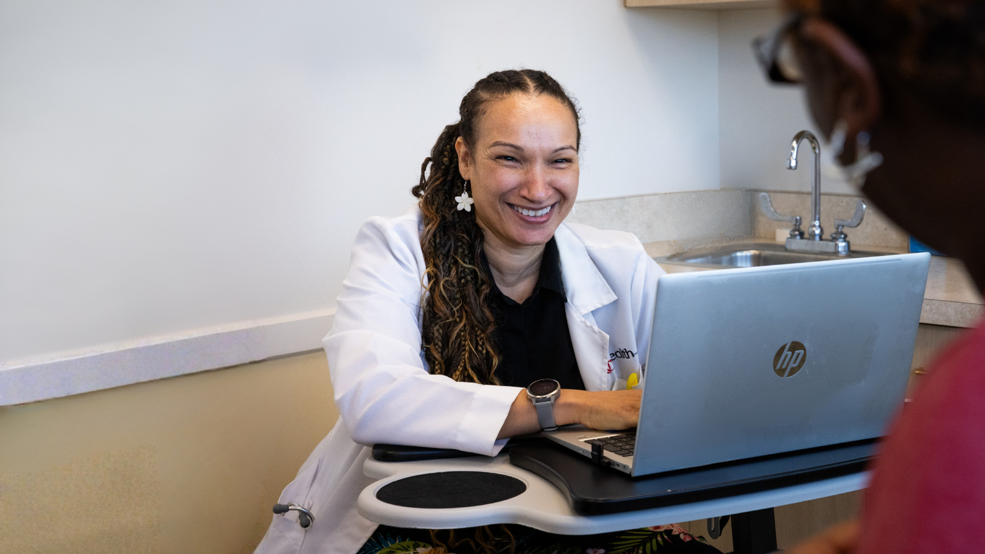 UC Health Primary Care doctor works with patient
