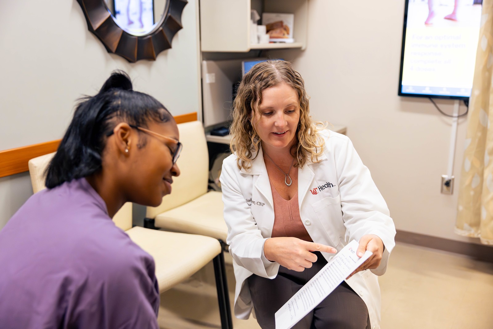 CNP at UC Cancer Center reviews results with a patient
