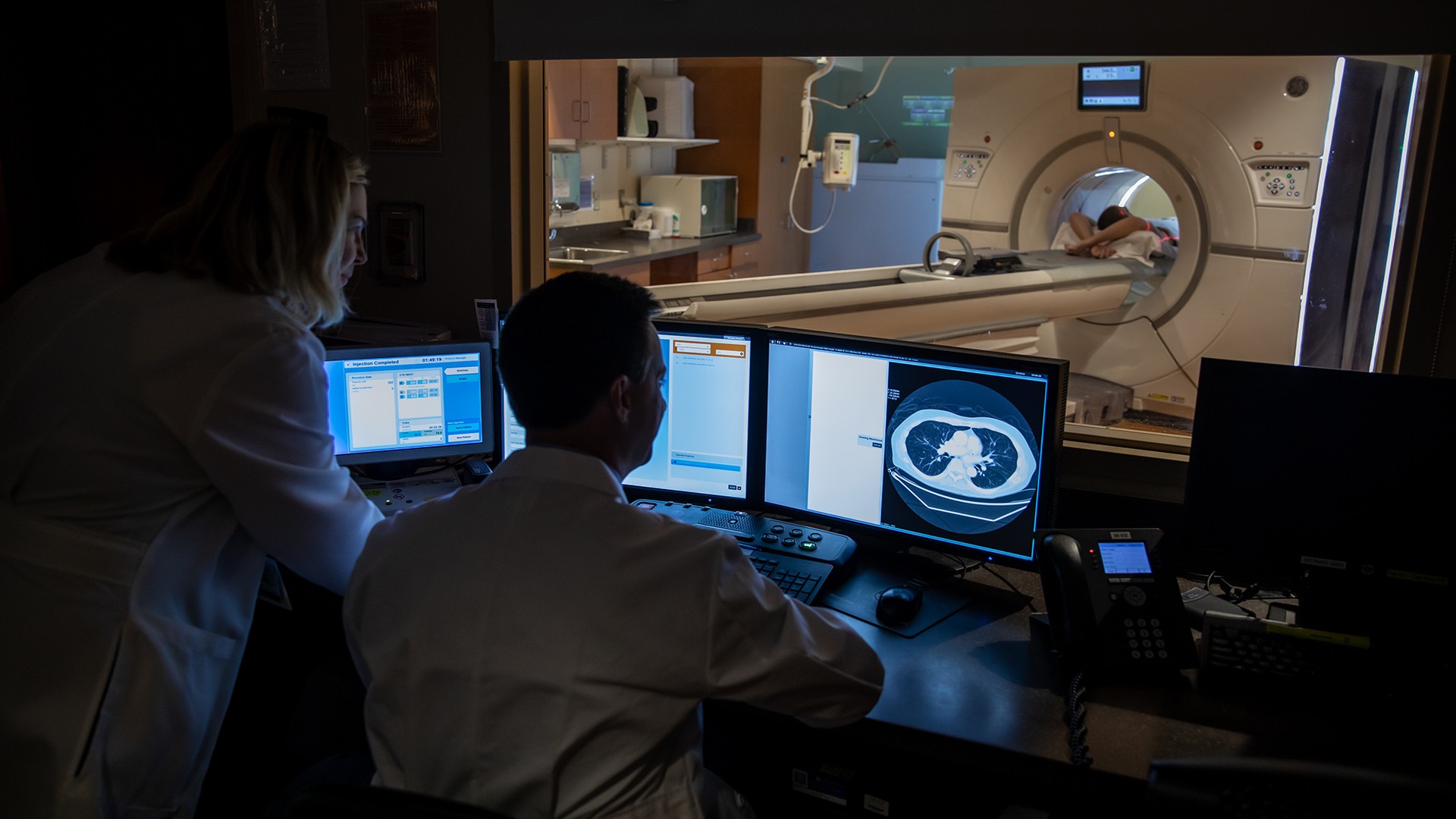 Lung cancer MRI and doctors looking at display