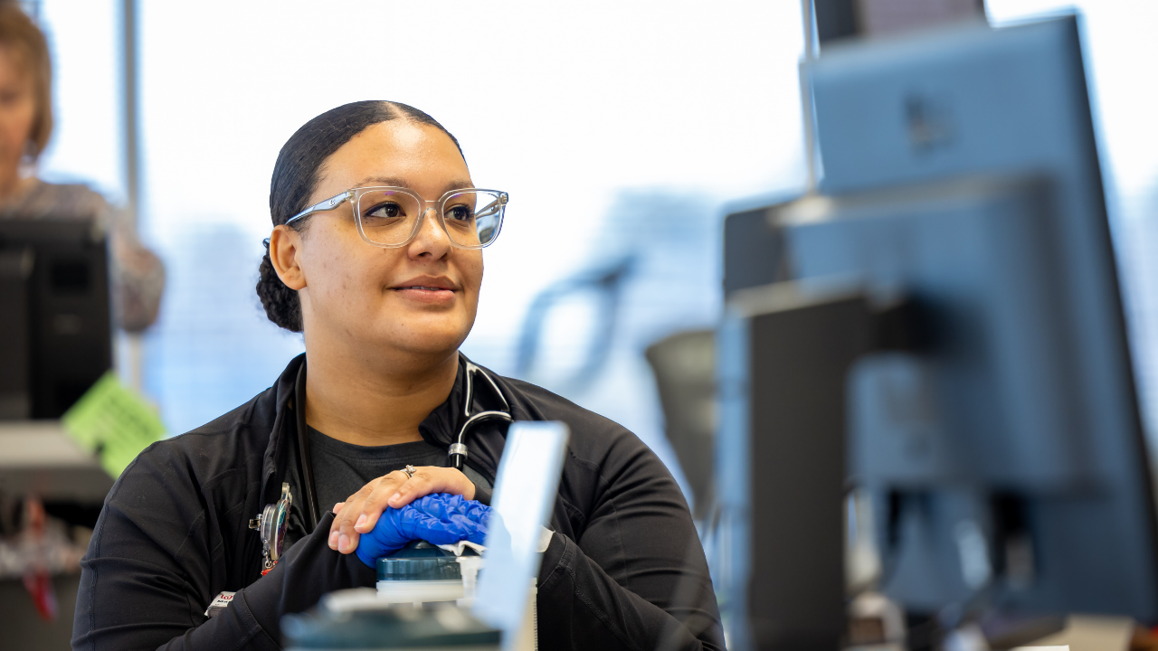 Team member smiles with patient at UC Health's Cardiac Rehabilitation 