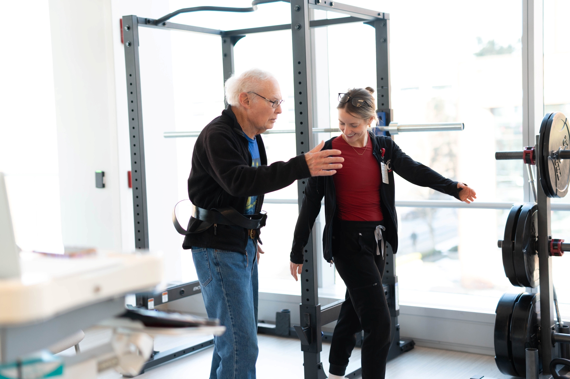 Physical therapist works with her excercising patients