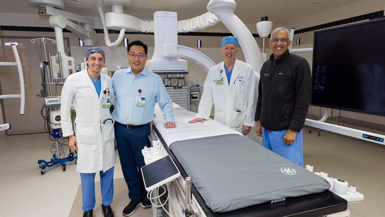Drs. Christiano Spadaccio, Sung Yang, Samuel Vester and Imran Arif stand in the new hybrid operating room at UC Health in Cincinnati, Ohio. 