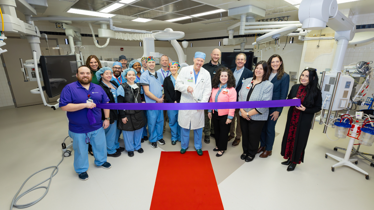 UC Health Cardiovascular team, in collaboration with the GE HealthCare representatives, honor the opening of the new Hybrid OR with a ribbon-cutting ceremony led by Dr. Samuel Vester.