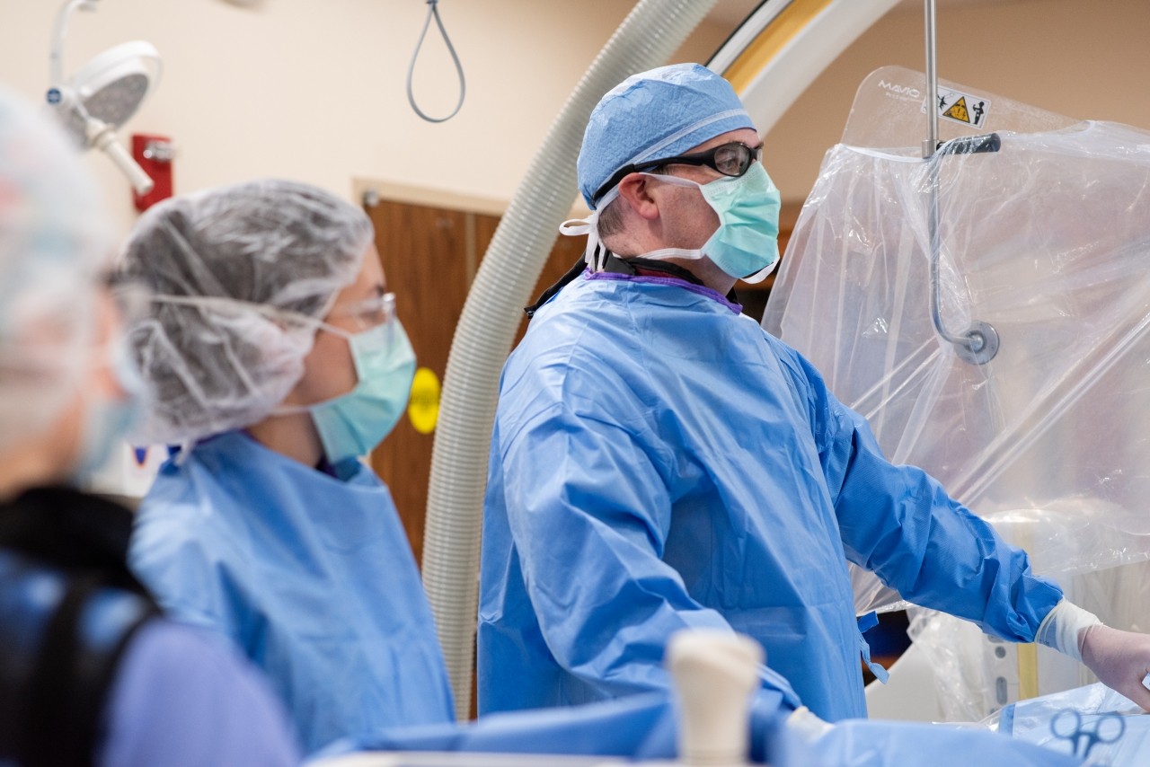Surgeon performs an endovascular procedure. 