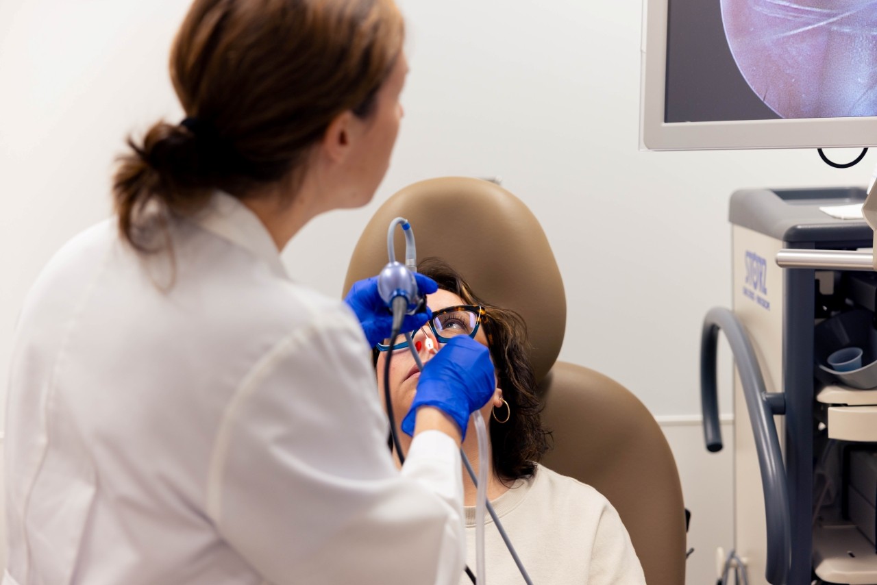 Surgeons perform a medical procedure.