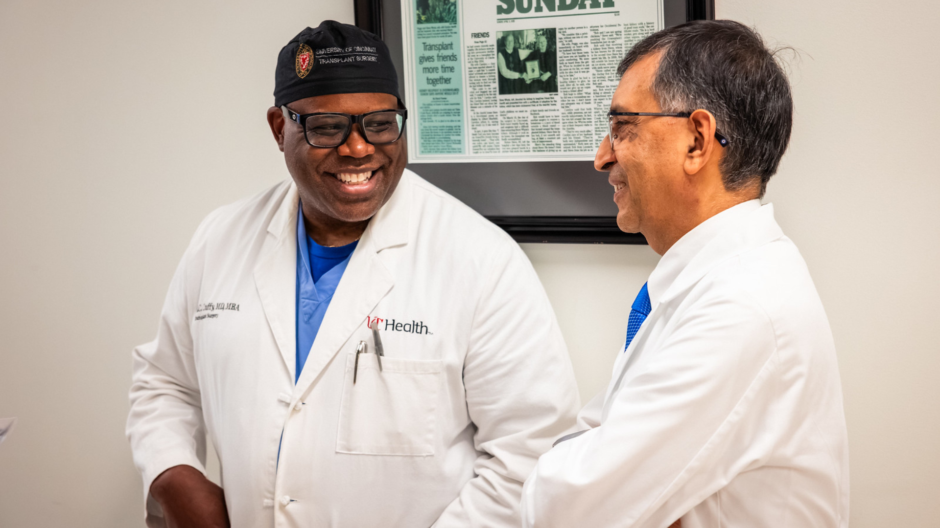 Dr. Cuffy and Dr. Govil smile together