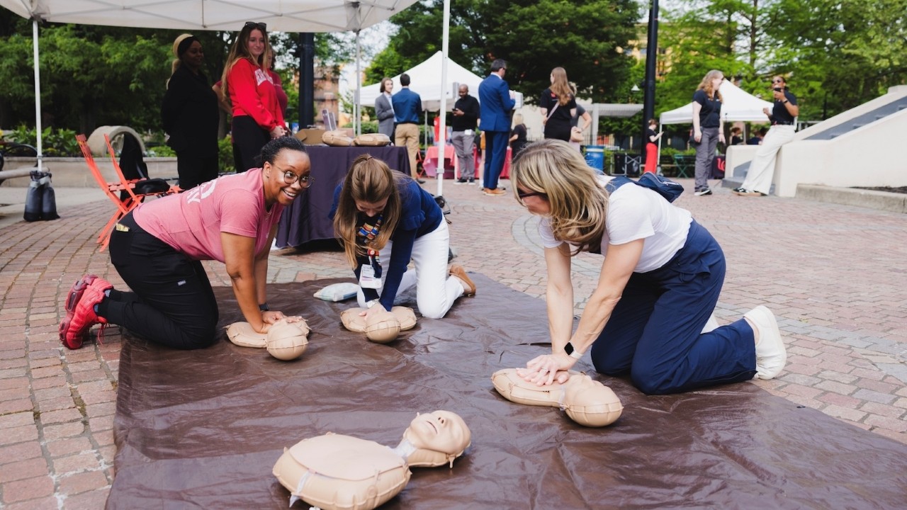 CPR on a mannequin during an education class.