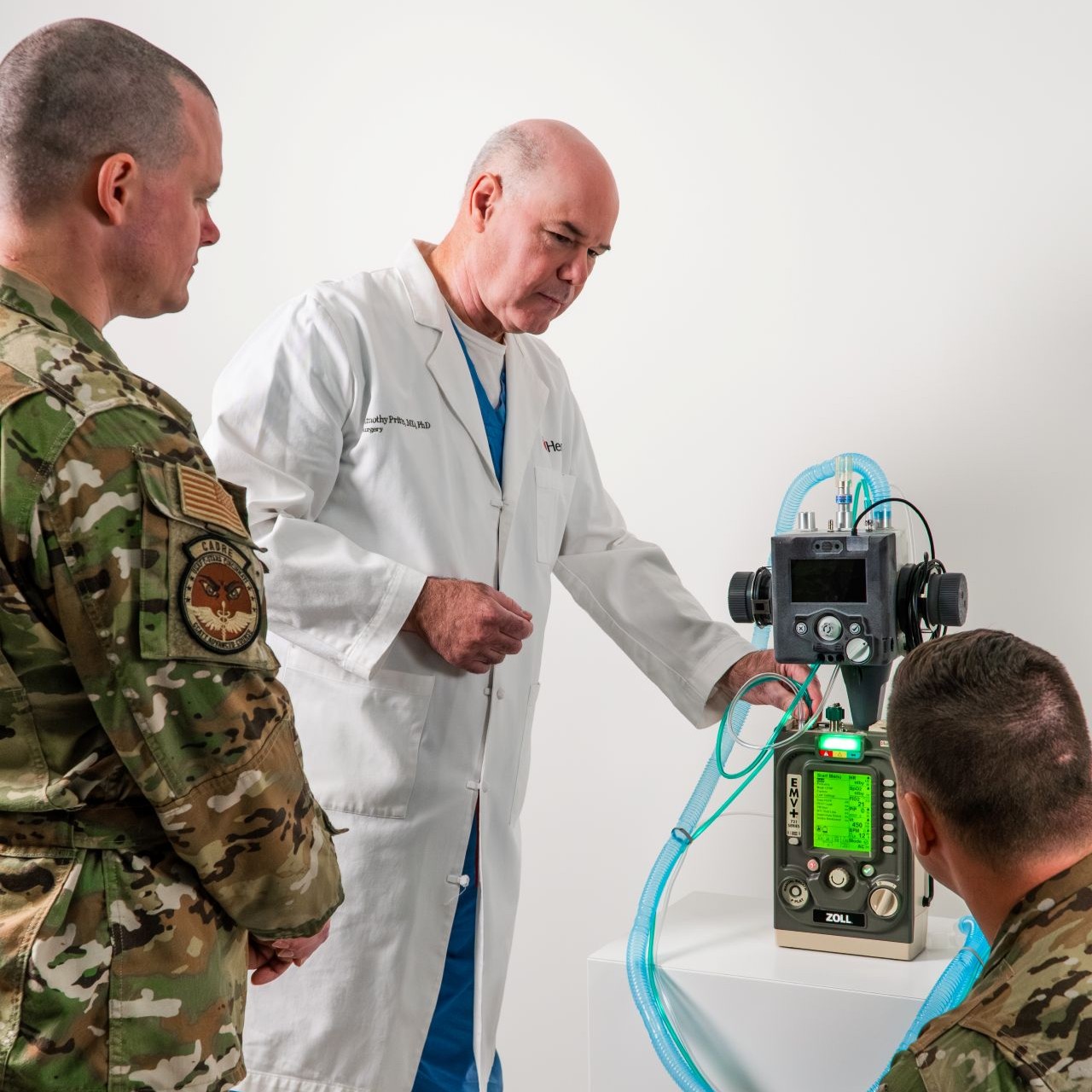 Dr. Pritts showing a double venalator to Air Force trainees. 