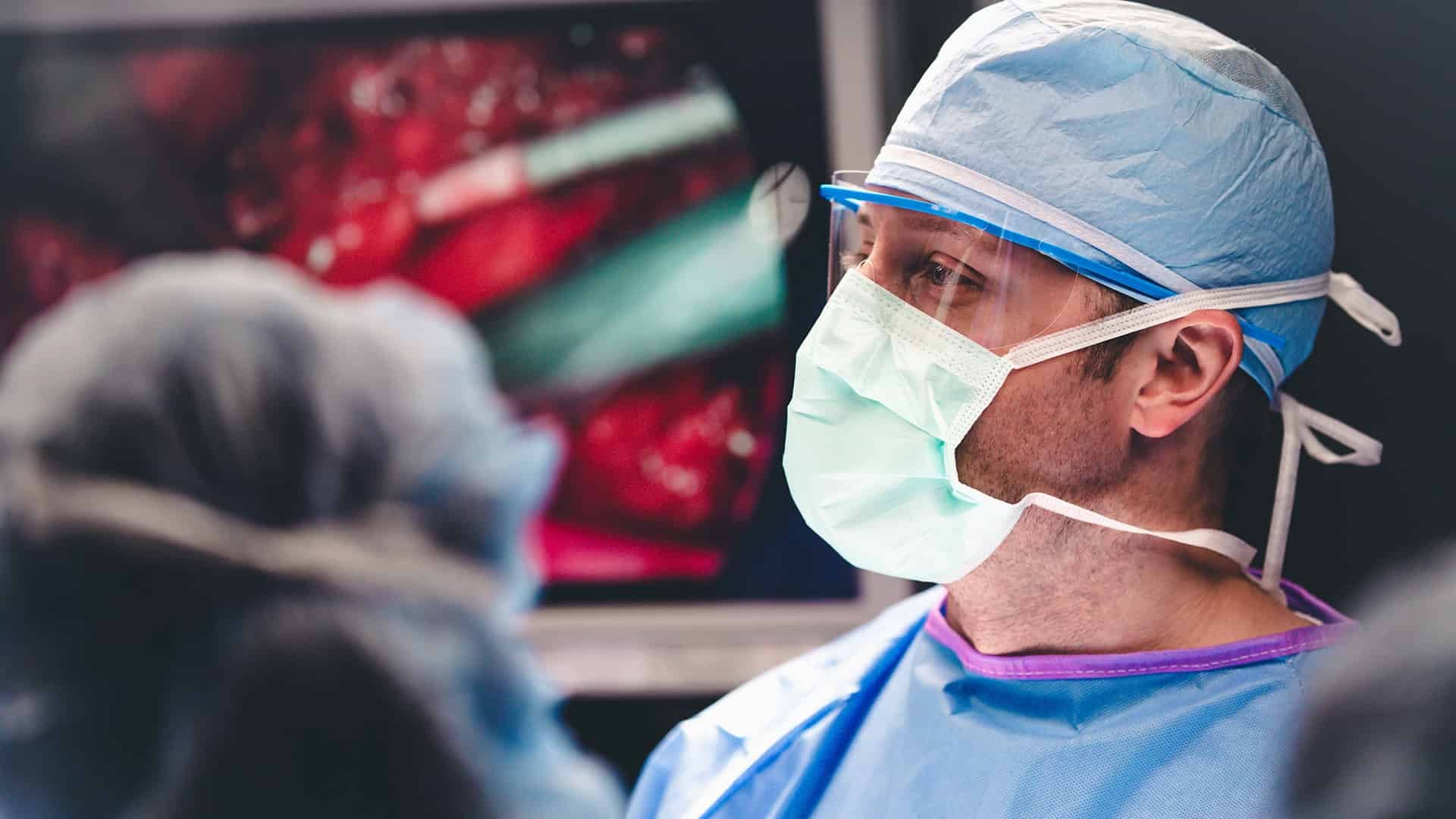 Doctor in scrubs preparing for a surgery in the WCH Level III Trauma Center.