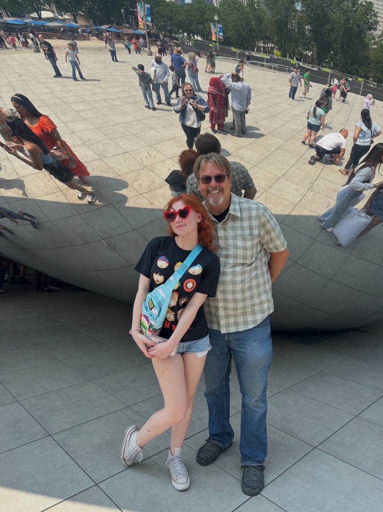 Chris Aldred with his daughter, Katy, in front of the Chicago bean.  