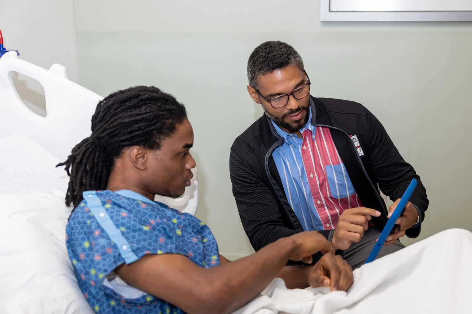 HVIP specialist educating a patient impacted by gun violence. 