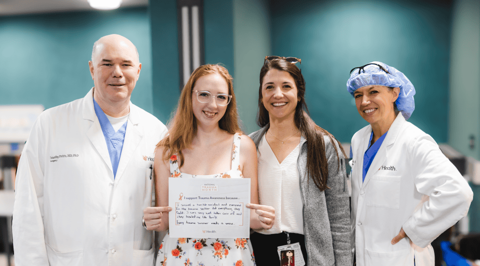 Patient reunion with Dr. Pritts and Dr. Makley for Trauma Awareness Month.