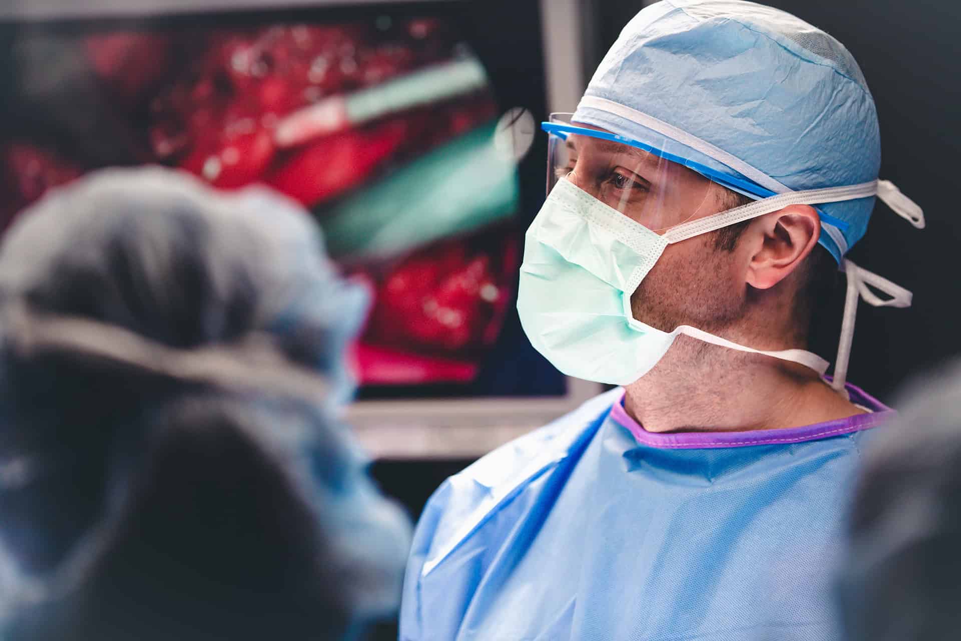 Doctor in scrubs preparing for a surgery in the WCH Level III Trauma Center.