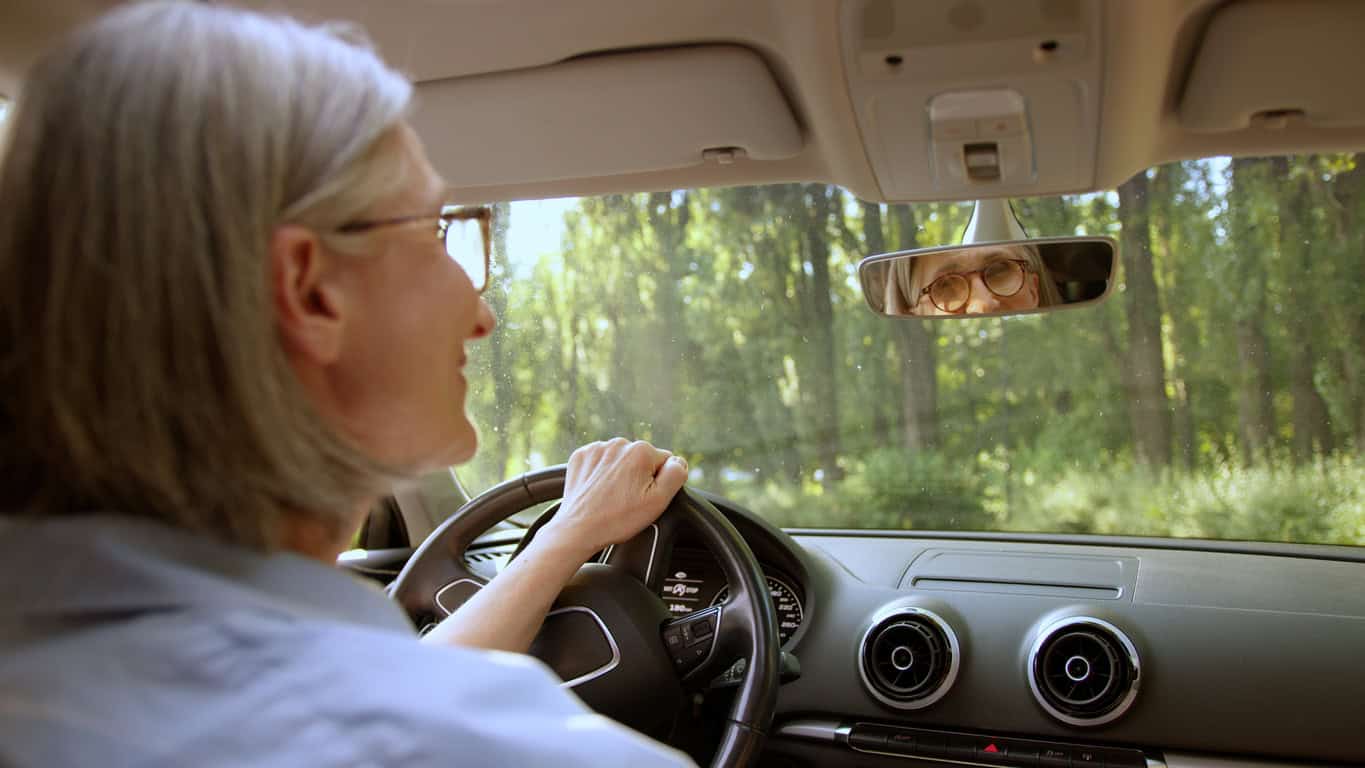 Older adult woman gets "fitted" to drive her car the safest way possible.