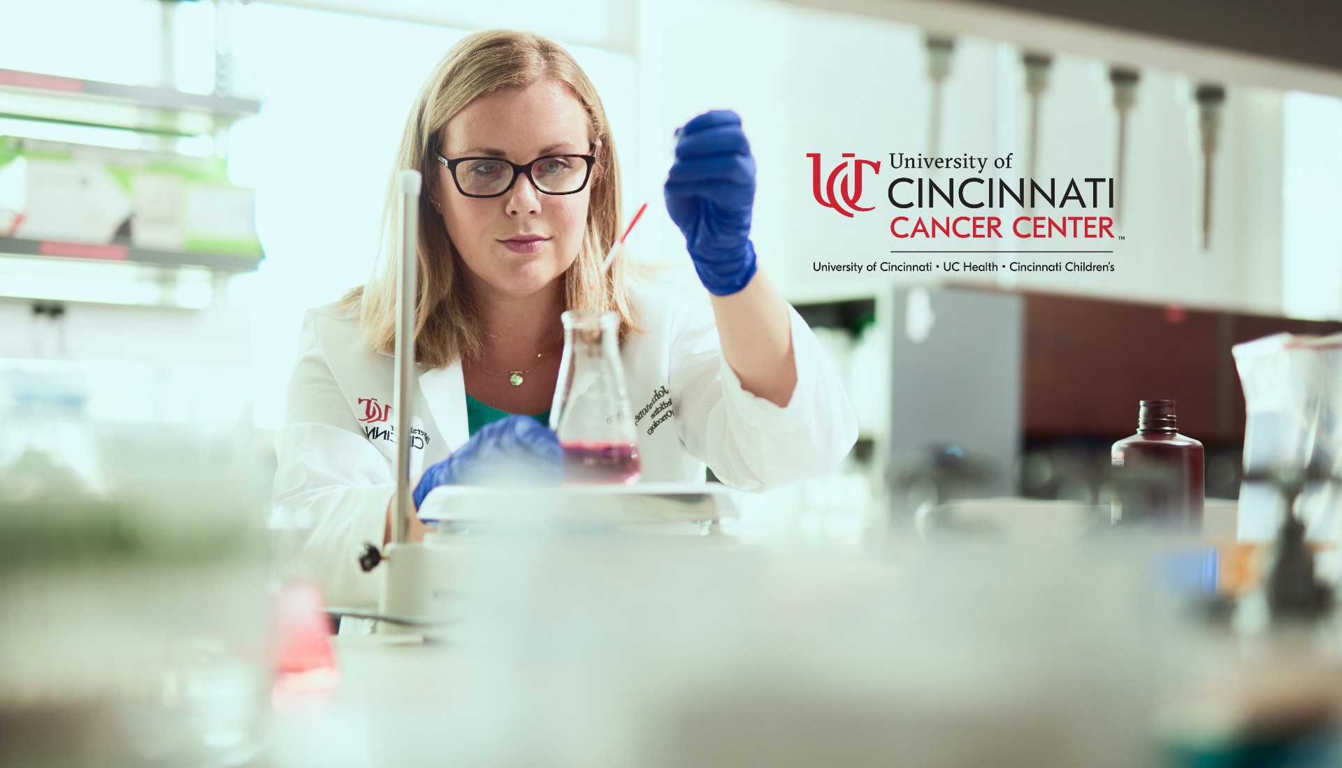 Physician works in a lab environment.