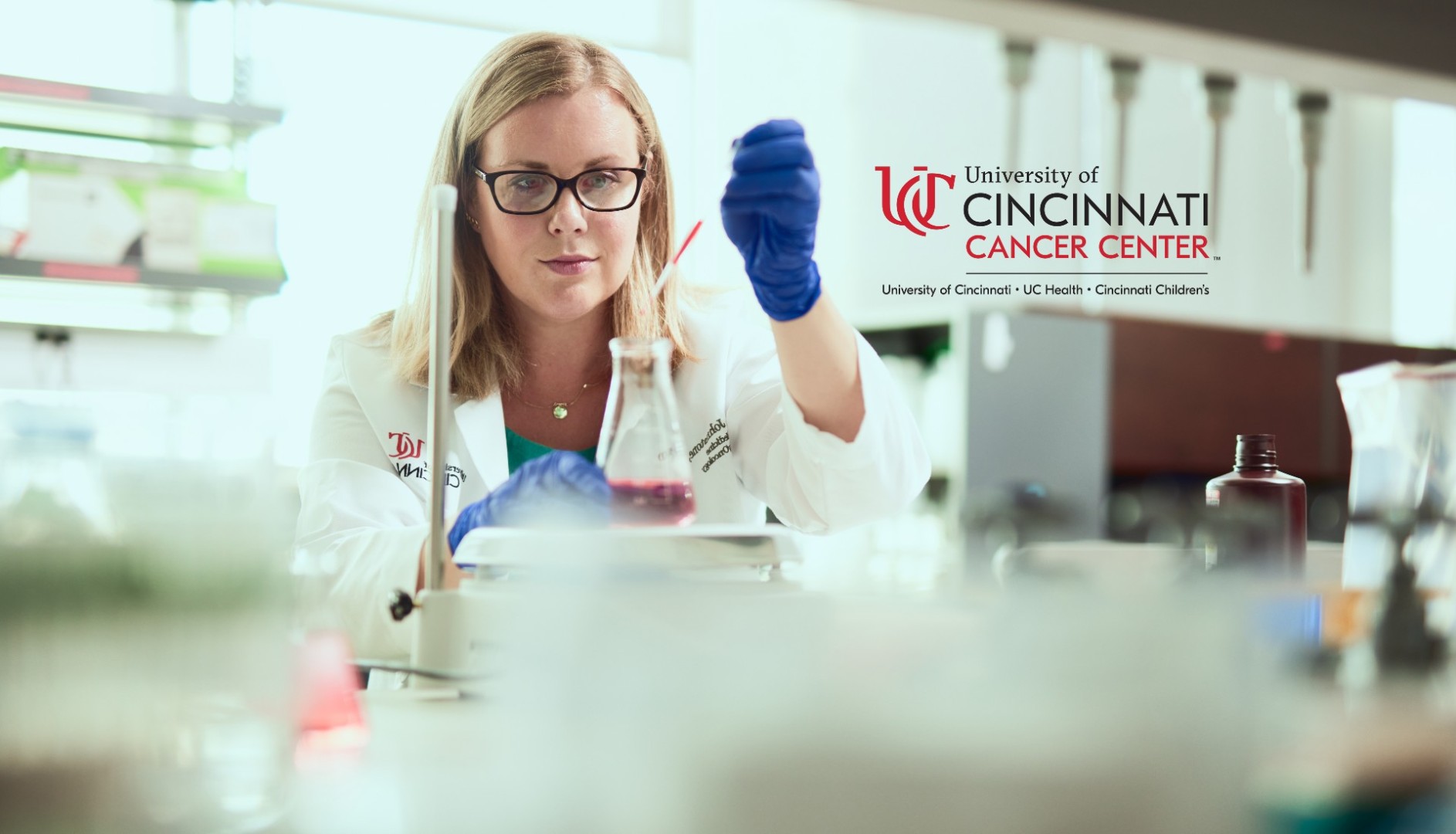 Physician works in a lab environment.