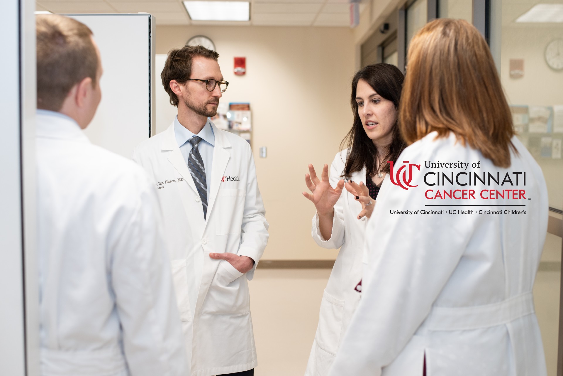 Medical providers talk in a medical environment. 