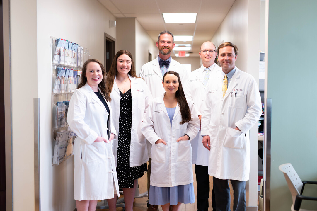 Young Onset Colorectal Cancer Care team stands together in hallway