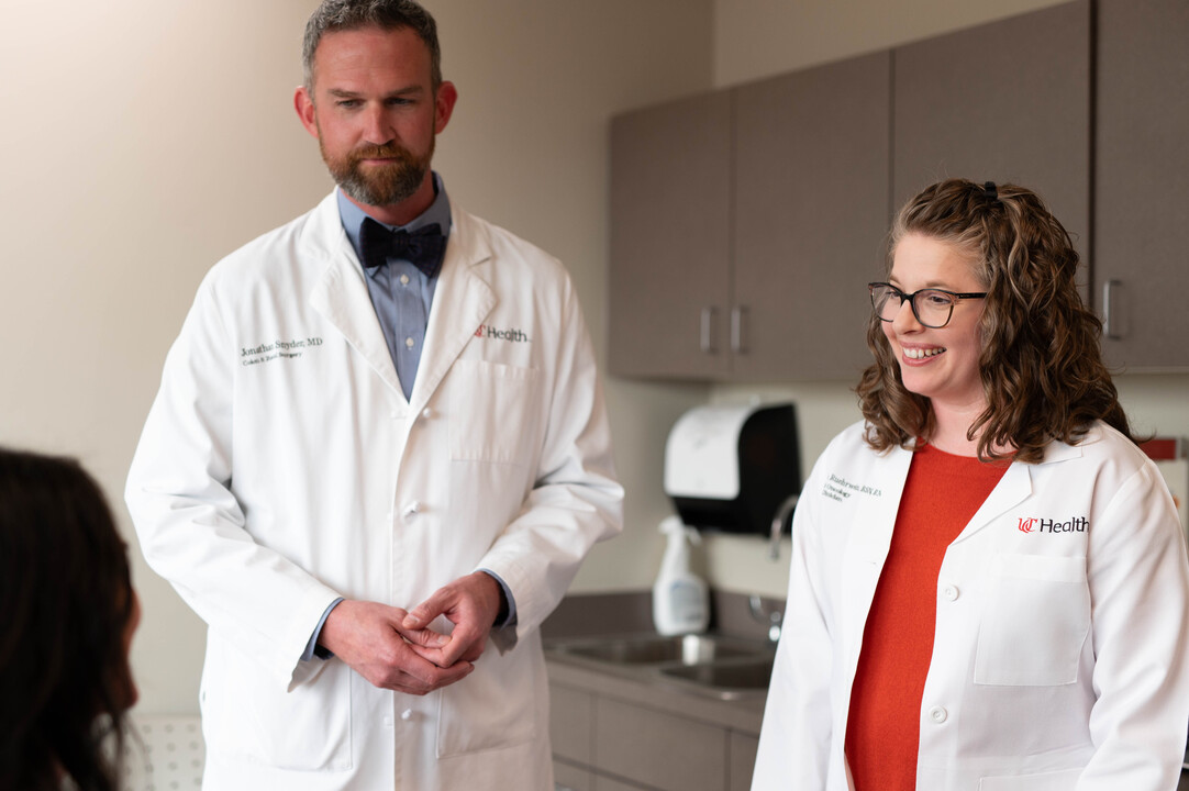 Nurse navigator and physican meet with patient during coordinated visit