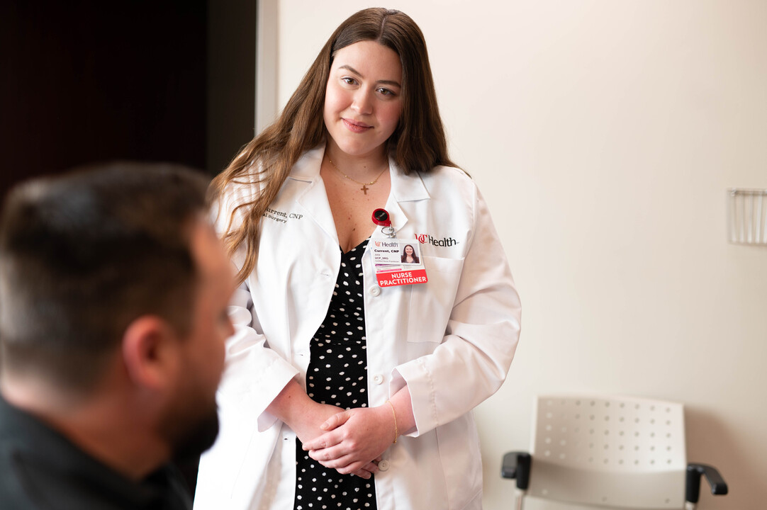 Nurse reviews patients results on computer screen 