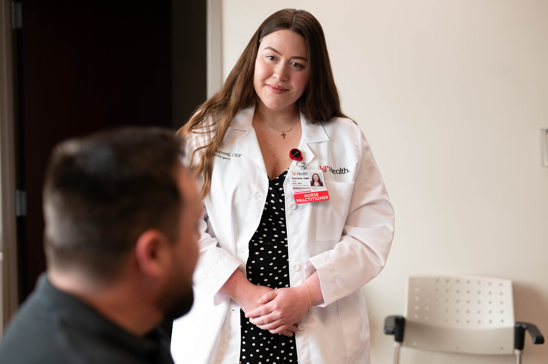 Physician and another provider attend to a patient. 