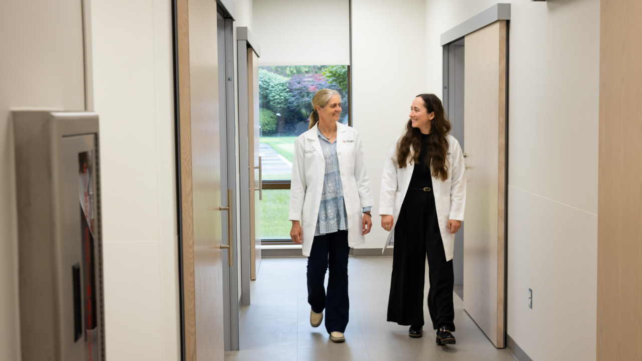 At UC Cancer Center, Providers Alli Dean and Jane Temple walk through the hallway of the Rapid Diagnostic Clinic in Cincinnati, Ohio