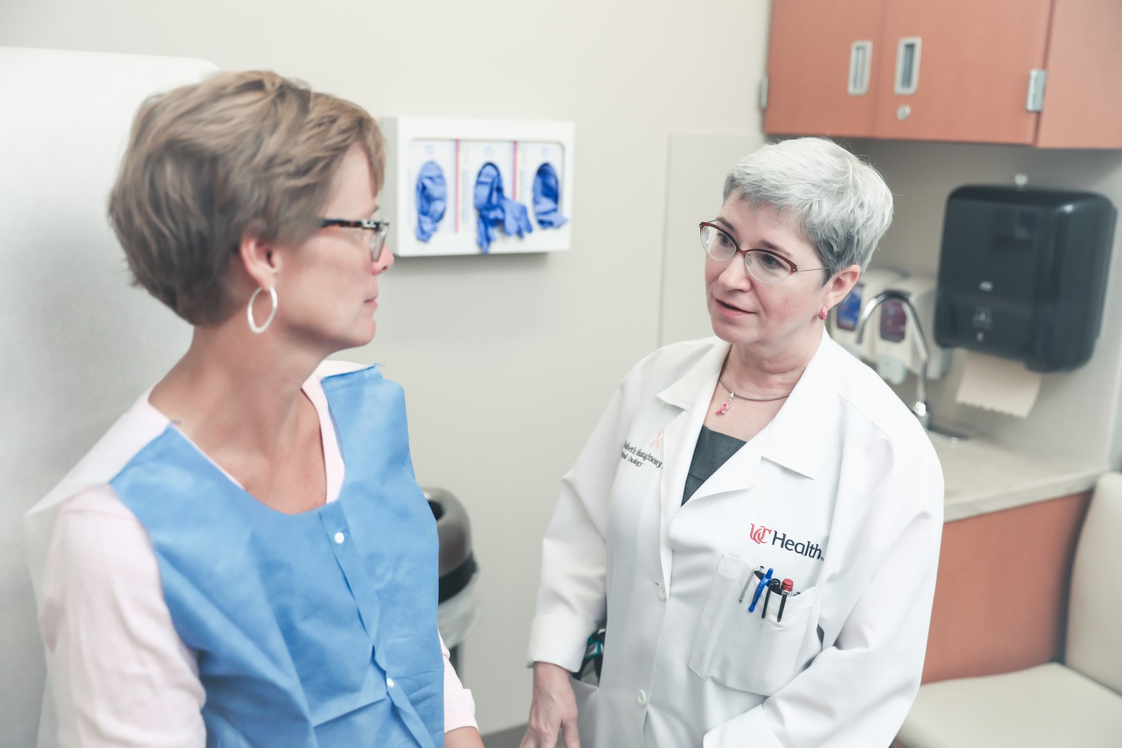 Physician talks with a patient.