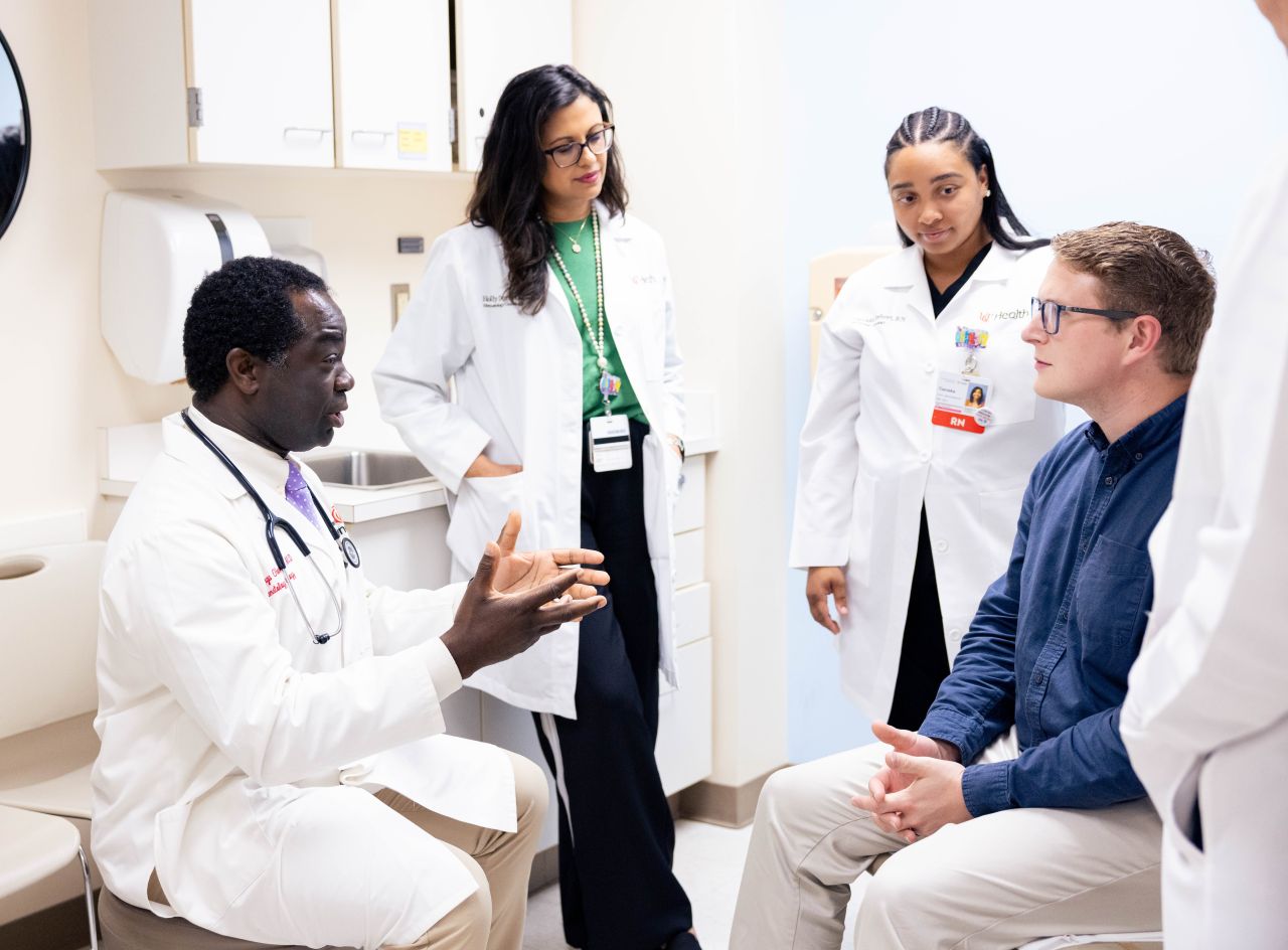 Physician team talks with patient. 
