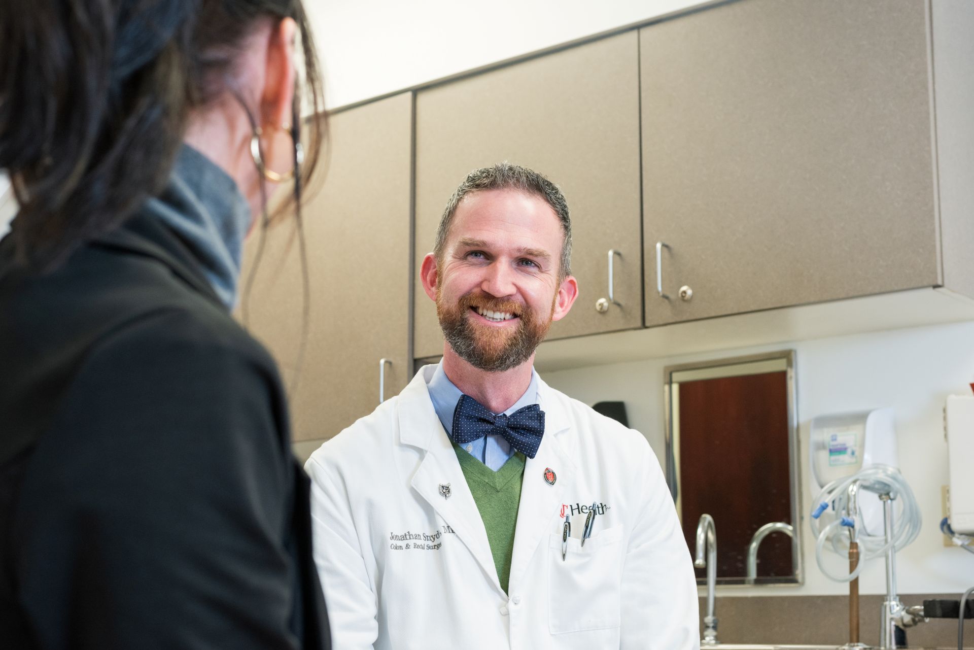 Doctor smiling at a patient. 