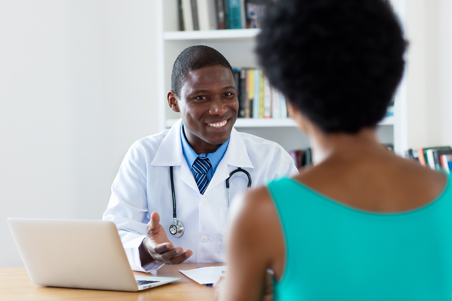 Physician talks with a patient. 