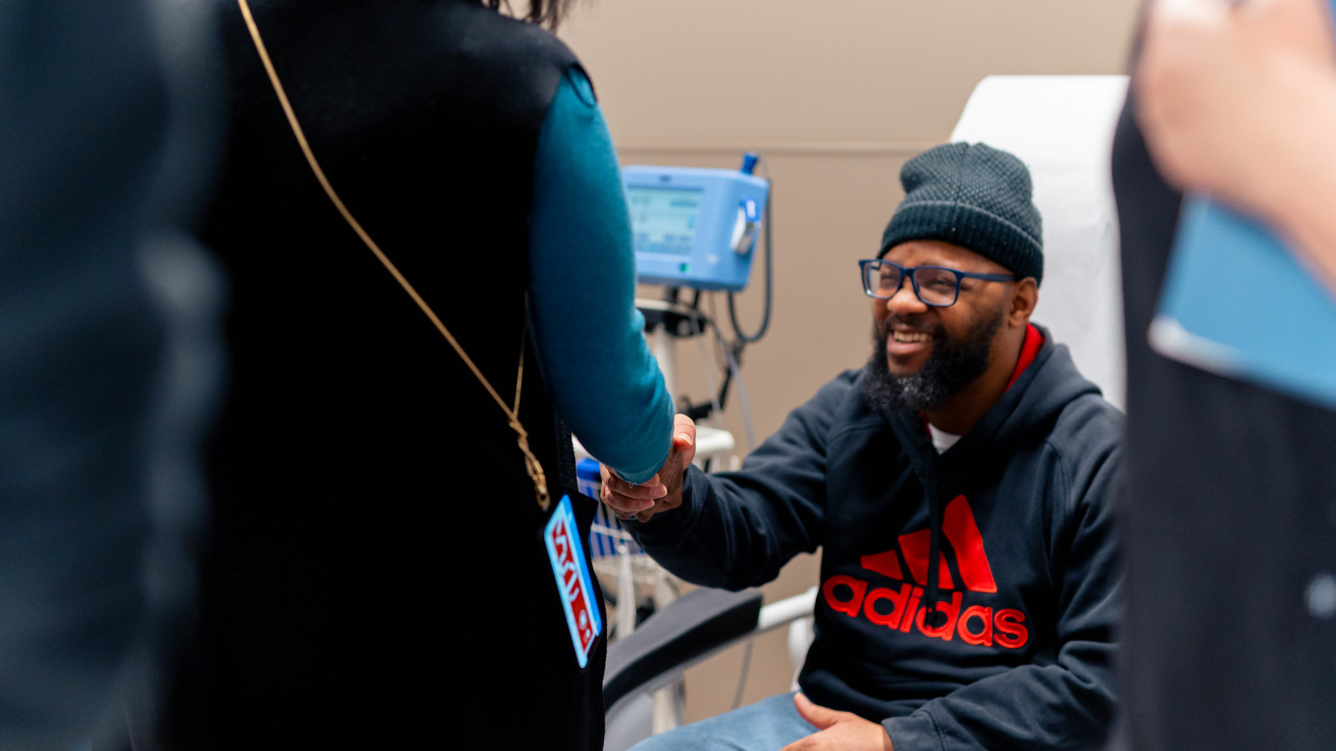 Doctor shakes patient's hand at UC Health