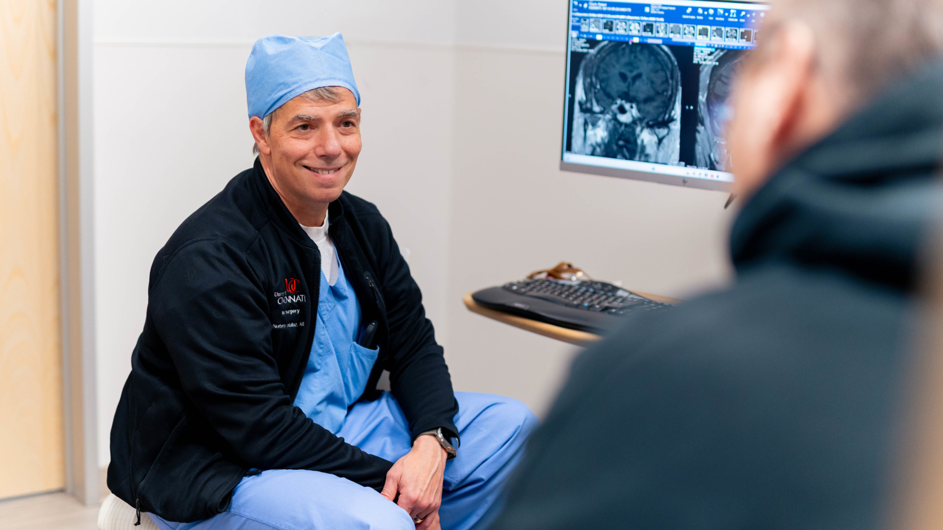 Dr. Andaluz meeting with a patient in medical office setting