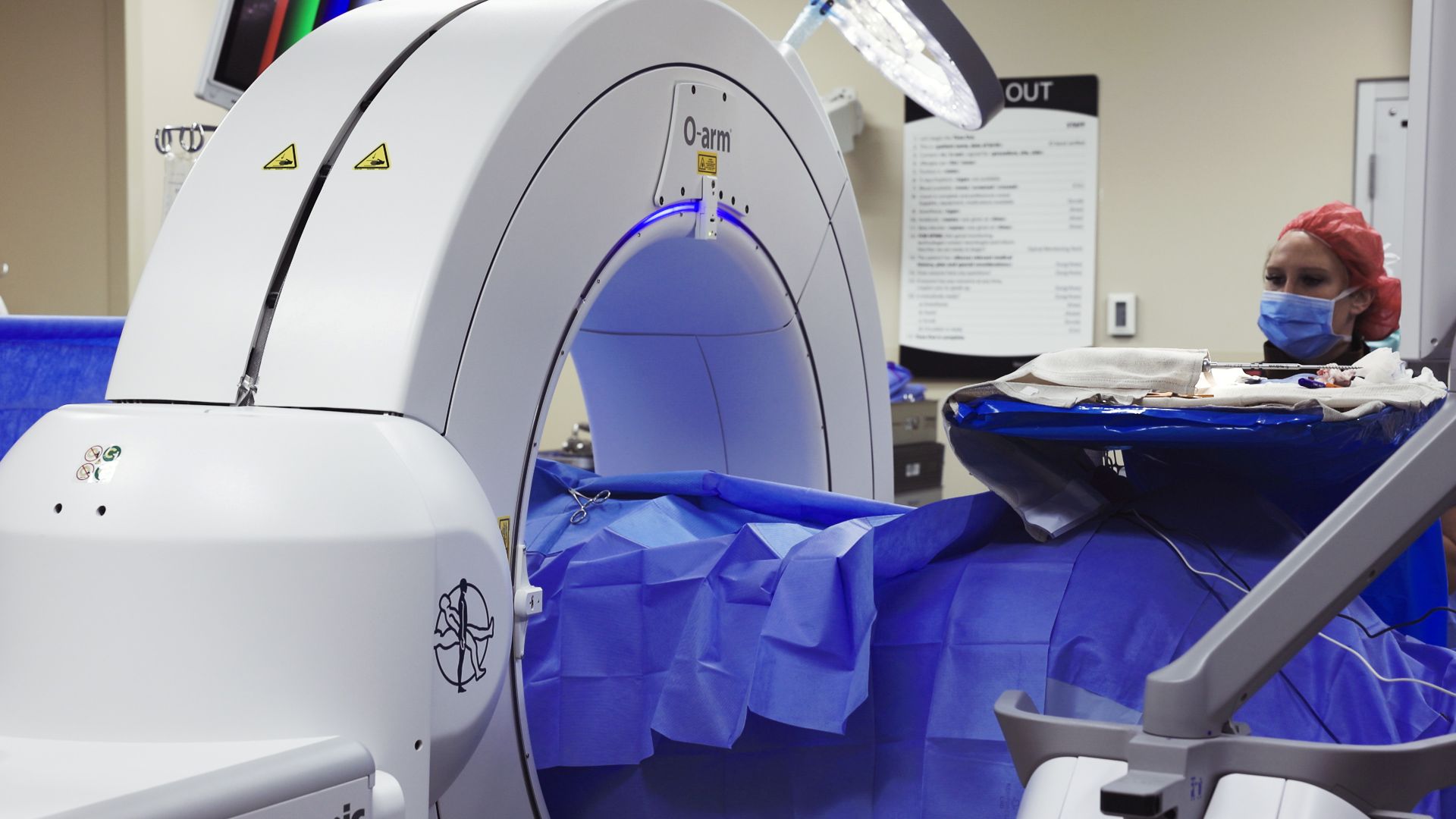 Physician works with equipment in a medical environment. 