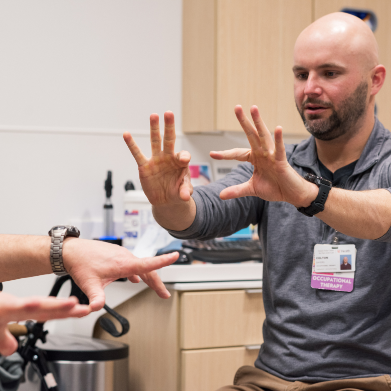 Therapists helps patient with care. 