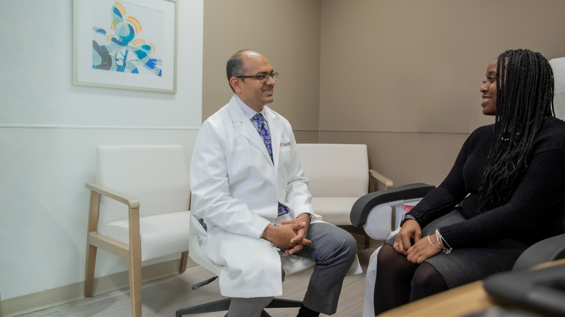 Dr. Ashgar meets in office setting with patient