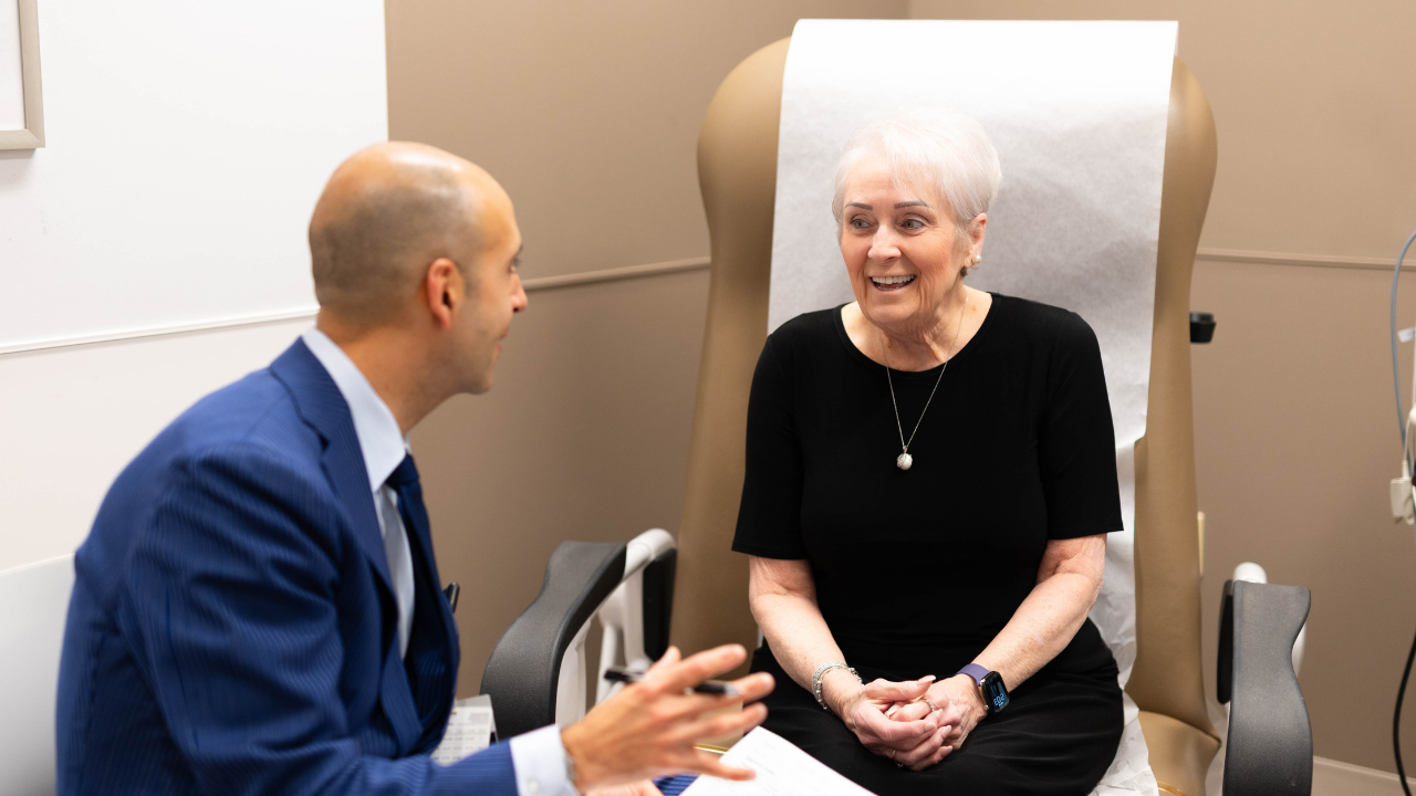Dr. Nasser meets with a patient in an exam room at the Back, Neck and Spine Center in Cincinnati, Ohio