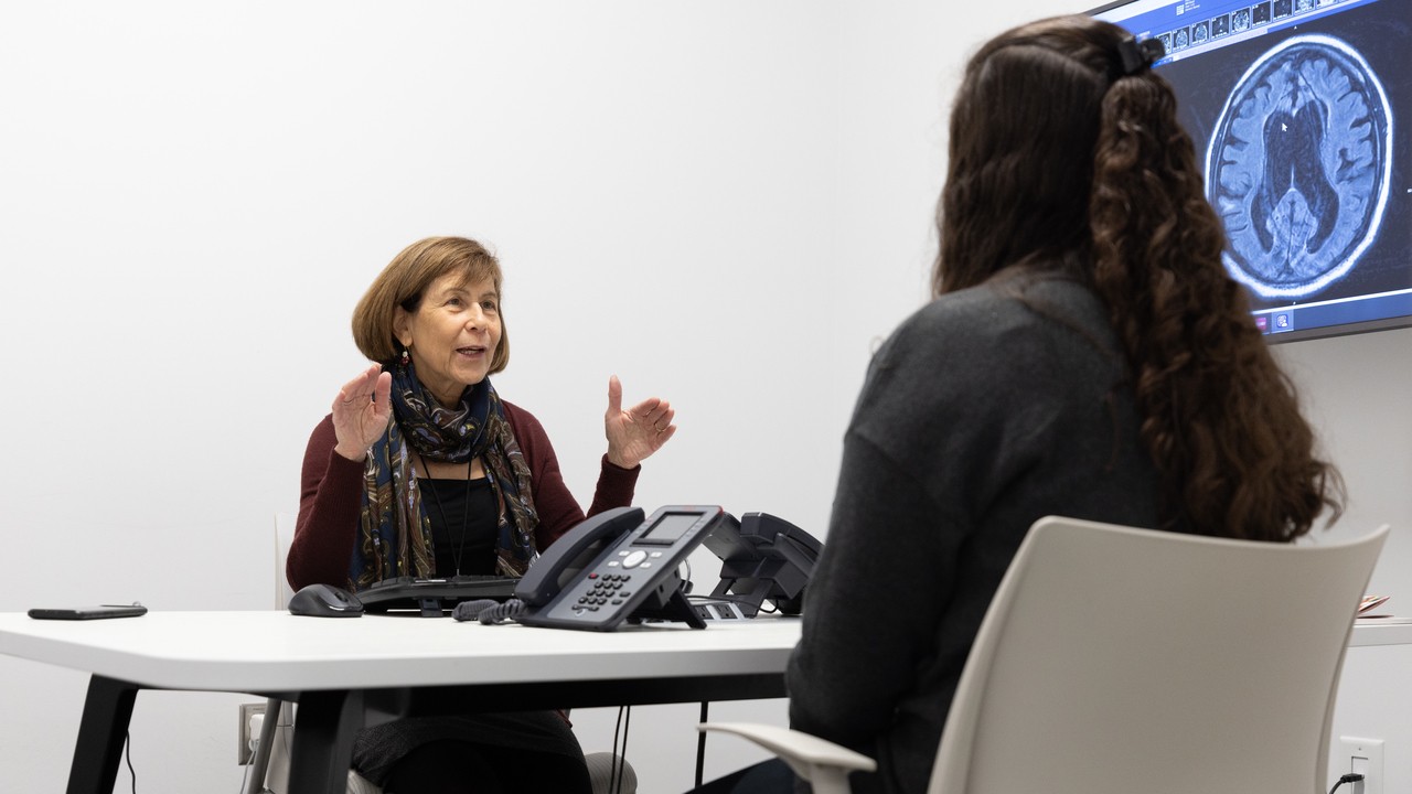 A patient talks with a medical provider in an office setting. 