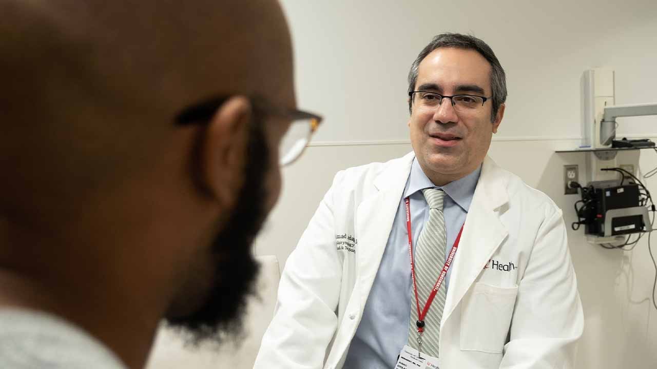 Physician talks with patient.