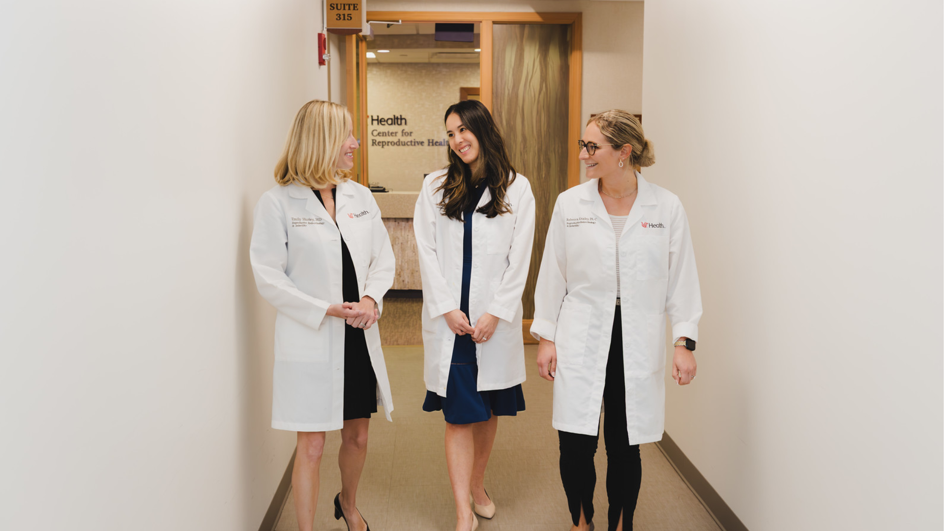 REI Physicians walk down a hallway