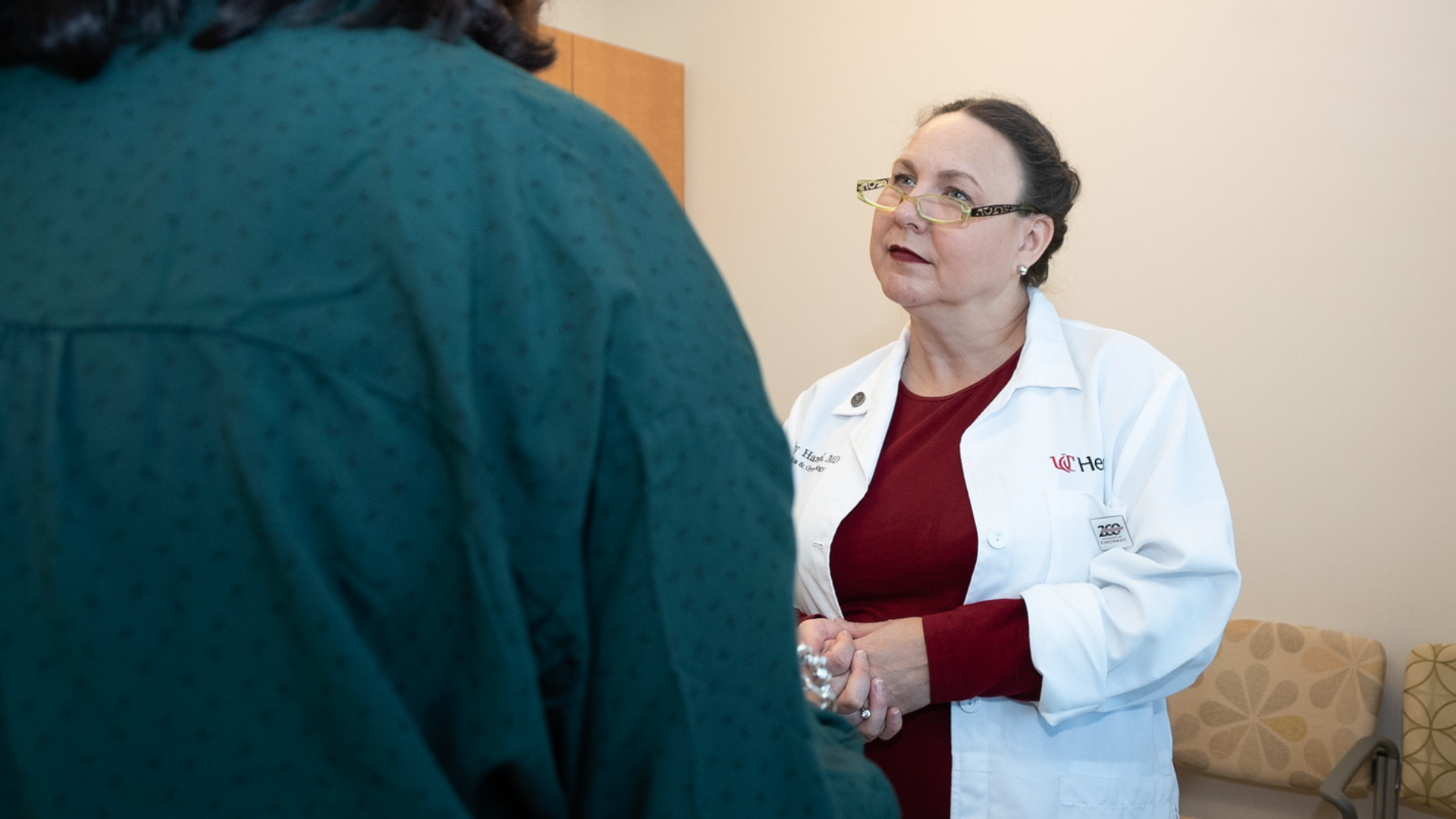 UC Health OBGYN meets with a patient in an office setting