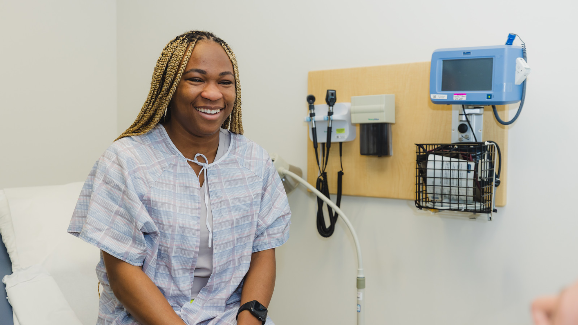 Patient in a gown for an exam. 