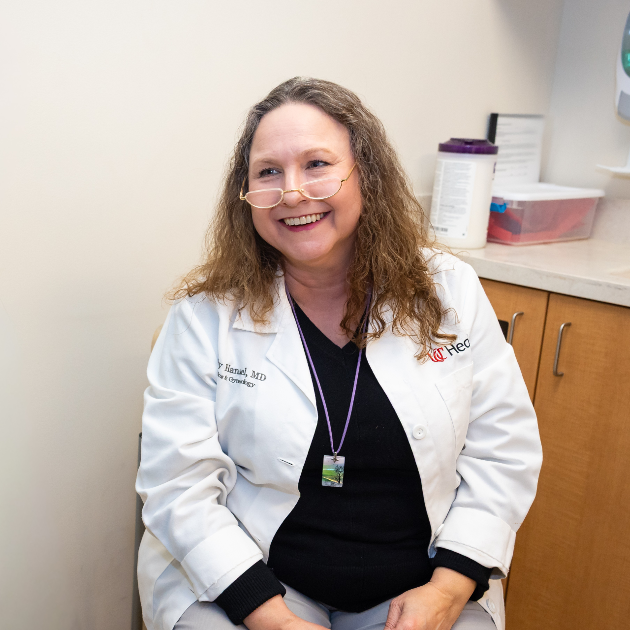 UC Health provider meets with patient in an office setting