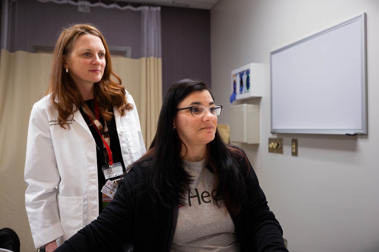 Two medical providers in a medical setting. 